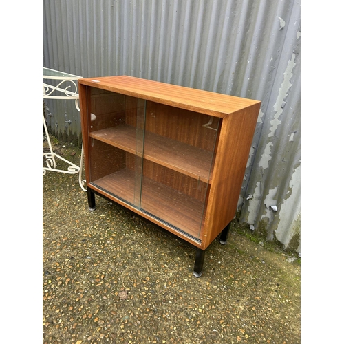 158 - A retro teak cabinet, wire work console table and a retro whatnot