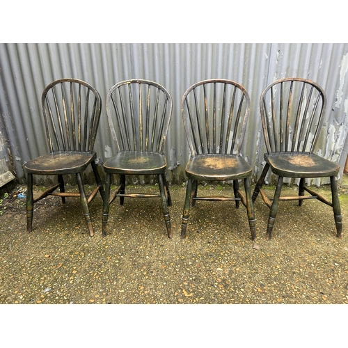 161 - A set of four country stick back kitchen chairs