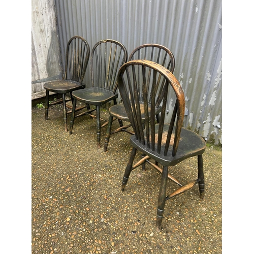 161 - A set of four country stick back kitchen chairs