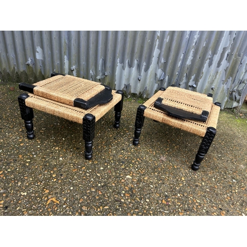 168 - A pair of african style low chairs with folding backs and cane seats