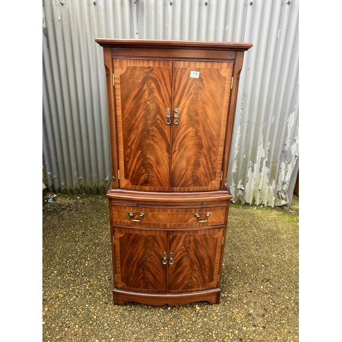 179 - A reproduction mahogany drinks cabinet