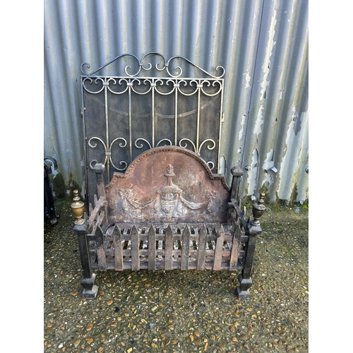 196 - An iron fire basket 55x27 together with a folding iron fire screen