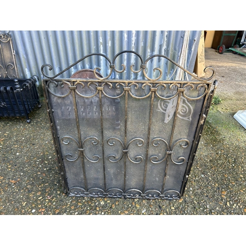 196 - An iron fire basket 55x27 together with a folding iron fire screen