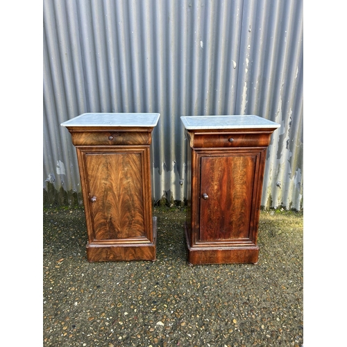 199 - A pair of continental mahogany single drawer bedsides with white marble tops