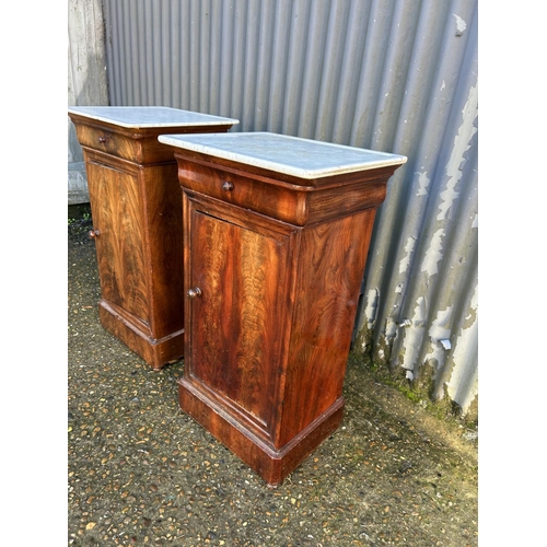 199 - A pair of continental mahogany single drawer bedsides with white marble tops