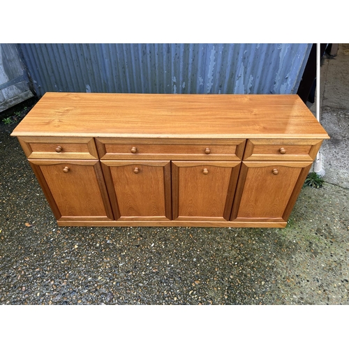 20 - Teak three drawer sideboard , 158 cms wide