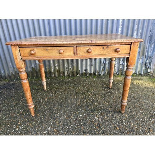 201 - A pine two drawer writing table 106x60x74