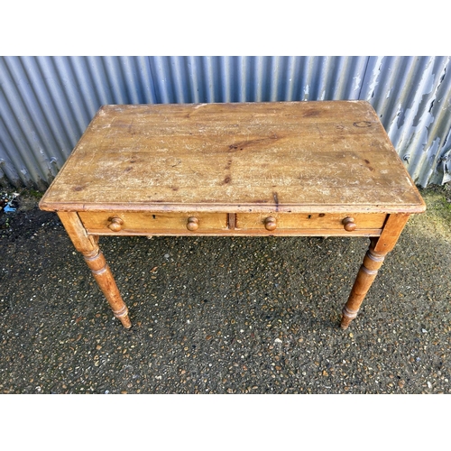 201 - A pine two drawer writing table 106x60x74