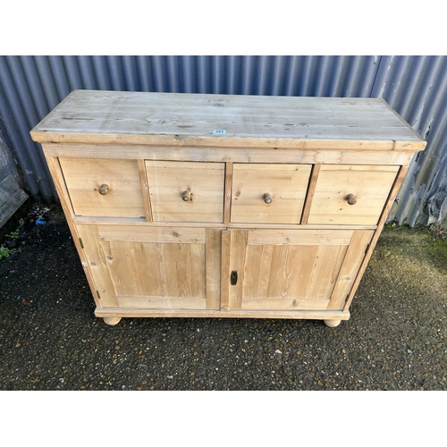 203 - A French pine sideboard with four drawers over cupboard doors  (with key) 118x38x100