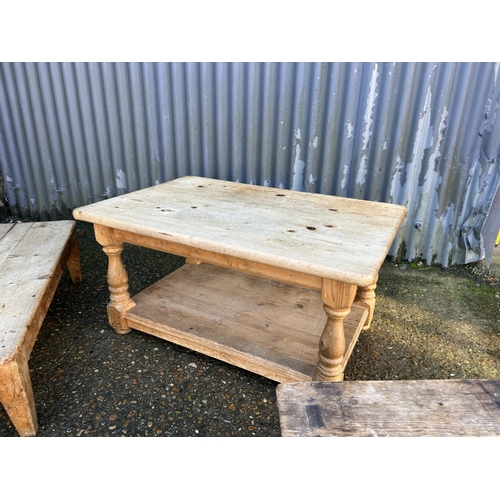 206 - A large solid pine coffee table together with two smaller country pine occasional tables