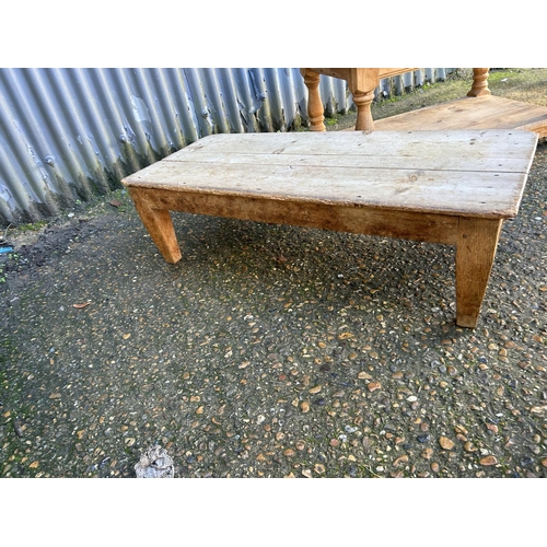 206 - A large solid pine coffee table together with two smaller country pine occasional tables