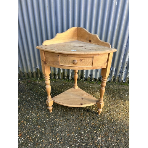 210 - A pine corner washstand with drawer