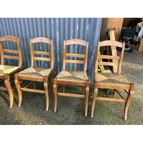 211 - A set of 6 French pine kitchen chairs with rush seats