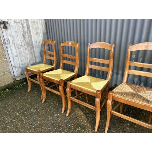 211 - A set of 6 French pine kitchen chairs with rush seats