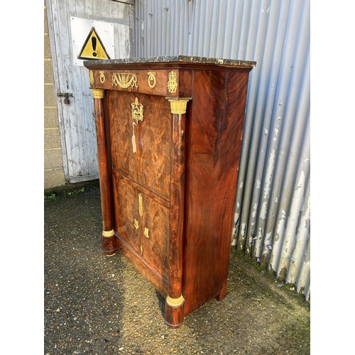 212 - A continental mahogany escritoire cabinet with drop front revealing satinwood interior, fitted with ... 