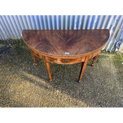 214 - A Victorian mahogany fold over card table with green baize