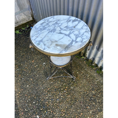 220 - A continental iron and brass framed table with white marble top 50x72