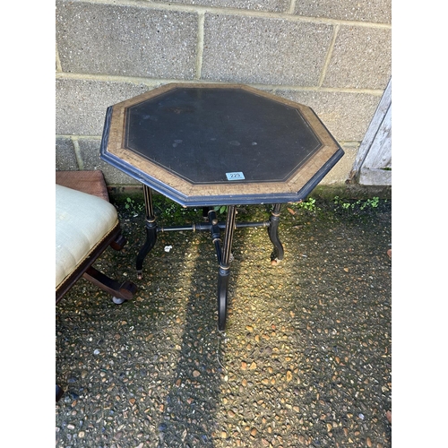 229 - An ebonised walnut occasional table together with a mahogany x frame stool