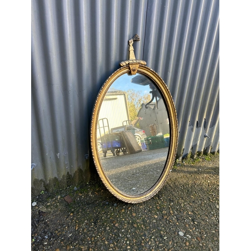 230 - An ornate gold gilt mirror 58x100