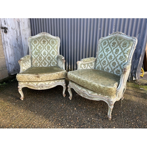 233 - A pair of green upholstered French armchairs