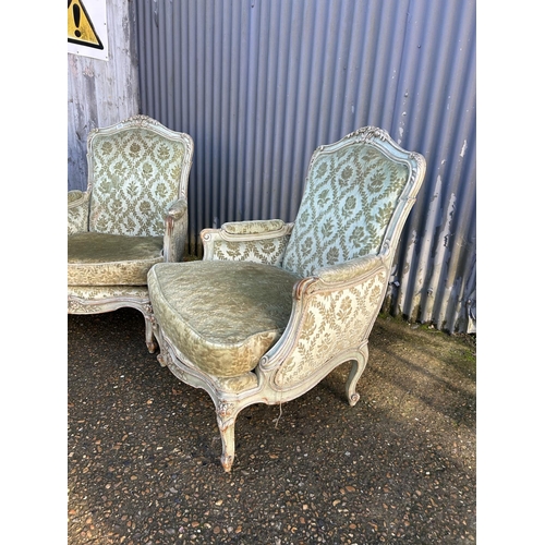 233 - A pair of green upholstered French armchairs