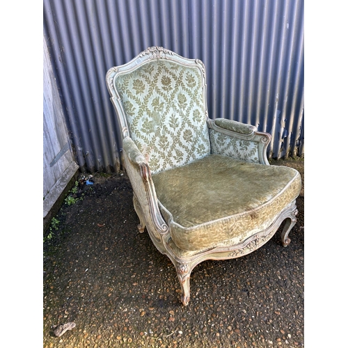 233 - A pair of green upholstered French armchairs