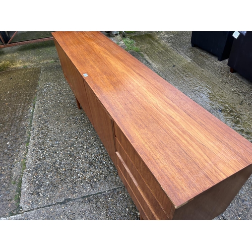 3 - A Mid century teak cocktail sideboard