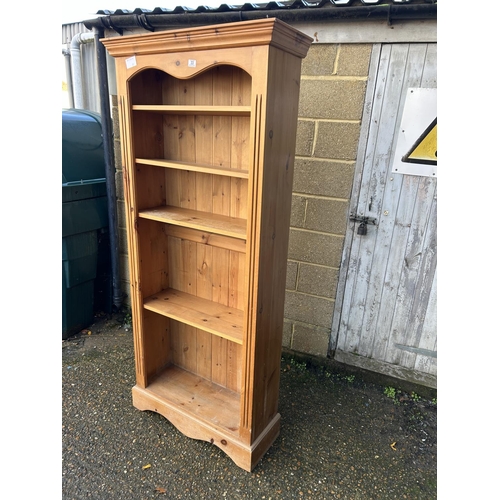 33 - A solid line open fronted bookcase with adjustable shelves 80x28x200