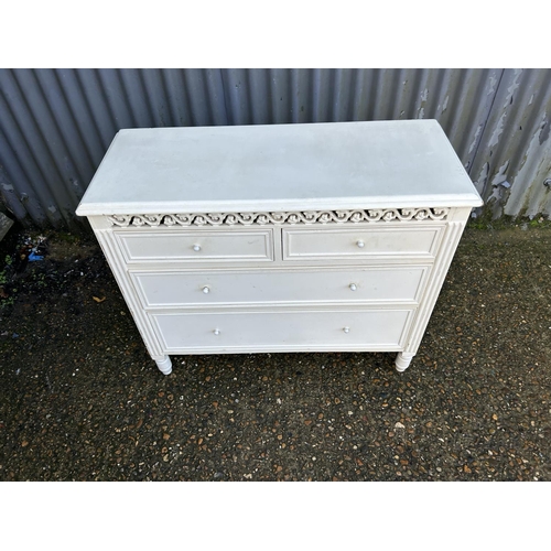 38 - A white painted chest of four drawers 90x37x75