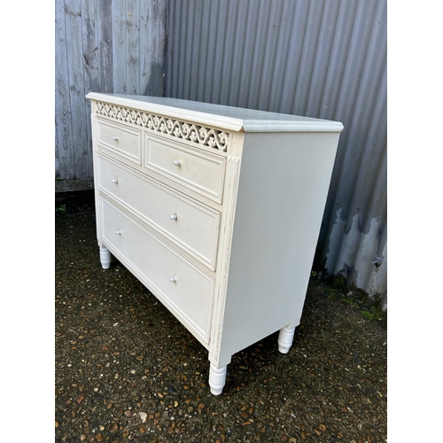 38 - A white painted chest of four drawers 90x37x75