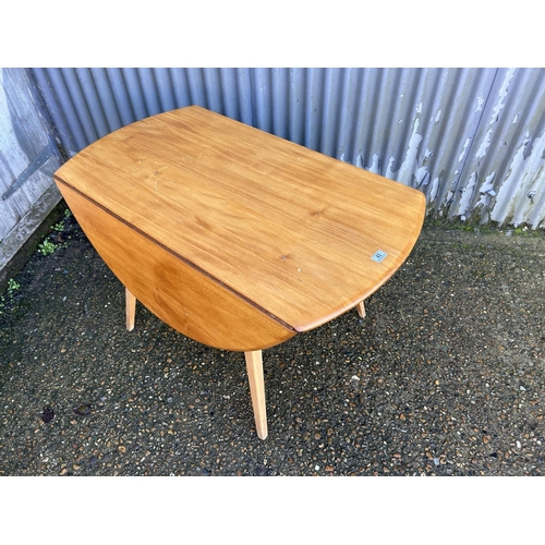 40 - An ercol light elm drop leaf kitchen table