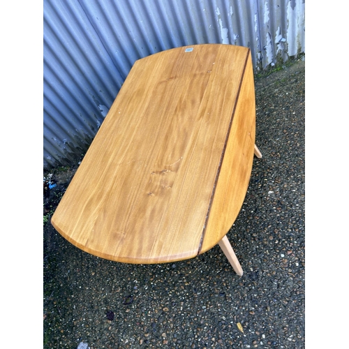 40 - An ercol light elm drop leaf kitchen table