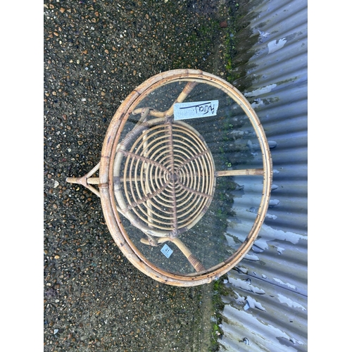 41 - A retro bamboo coffee table with glass top 70cm diameter