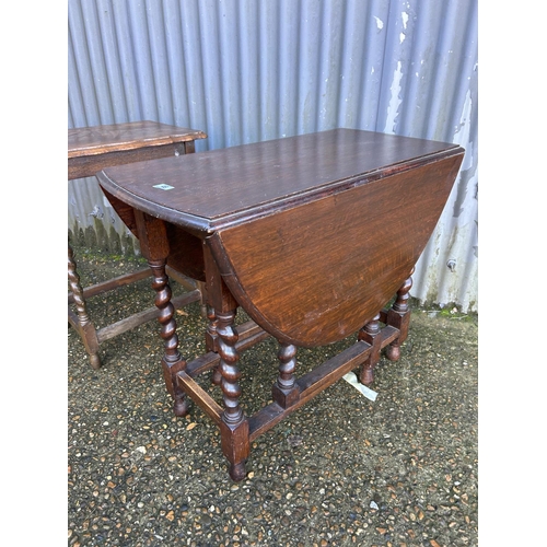 46 - An oak gateleg table together with a barley twist occasional table