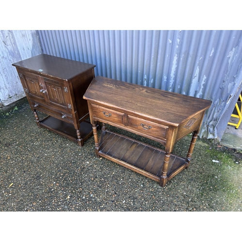 47 - An oak two drawer sideboard together with a oak two door cupboard