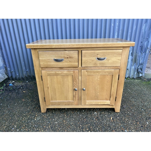 49 - A light oak two drawer sideboard 105x44x87