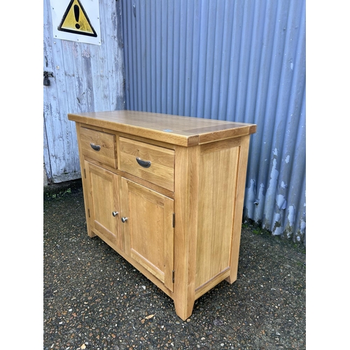 49 - A light oak two drawer sideboard 105x44x87