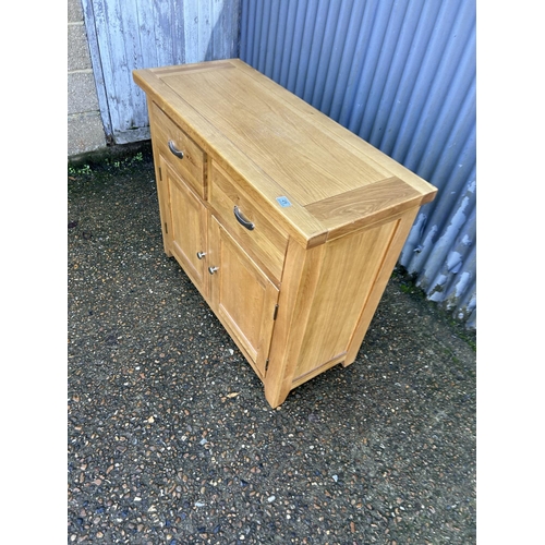 49 - A light oak two drawer sideboard 105x44x87