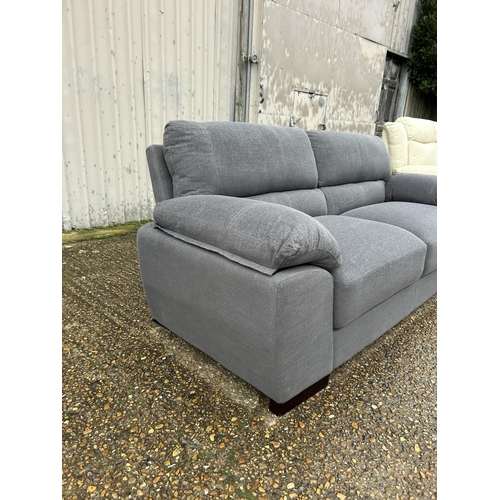 5 - As new ex shop display grey upholstered sofa 200 cms wide