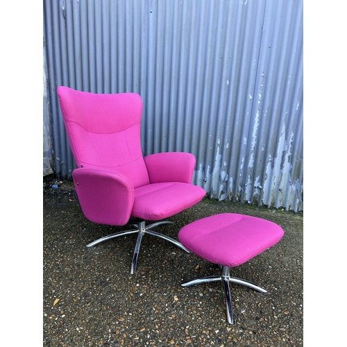 50 - A pink upholstered reclining easy chair on chrome base with matching stool LABELLED DENMARK