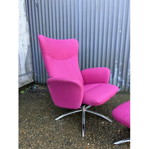 50 - A pink upholstered reclining easy chair on chrome base with matching stool LABELLED DENMARK