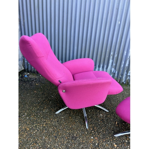 50 - A pink upholstered reclining easy chair on chrome base with matching stool LABELLED DENMARK