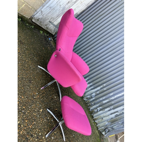 50 - A pink upholstered reclining easy chair on chrome base with matching stool LABELLED DENMARK