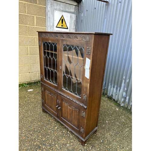 52 - A leaded oak cabinet 100x32x135