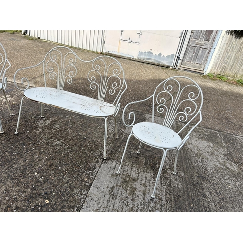 57 - A vintage white painted metal garden bench and two chairs set