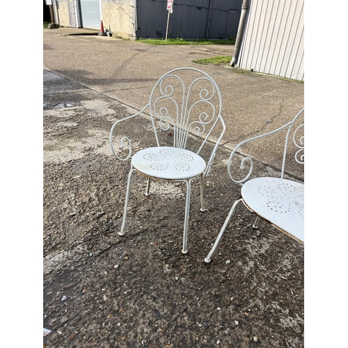 57 - A vintage white painted metal garden bench and two chairs set