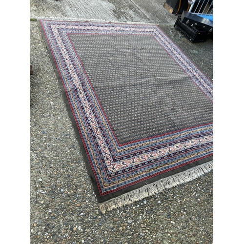 59 - A good quality red, blue and brown pattern oriental carpet 285x220