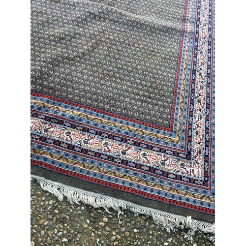 59 - A good quality red, blue and brown pattern oriental carpet 285x220