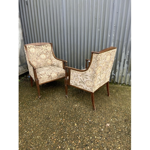 64 - A pair of Edwardian mahogany framed salon chairs