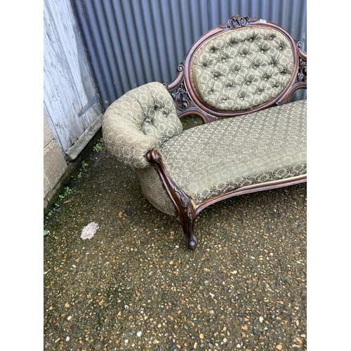 66 - A Victorian mahogany framed chaise lounge / love seat with green upholstery 170cm wide